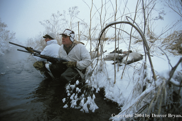 Waterfowl hunters with bagged geese.