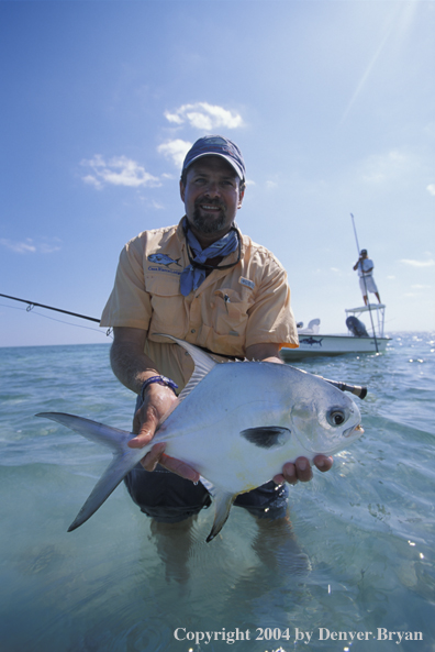 Saltwater flyfisherman holding permit.