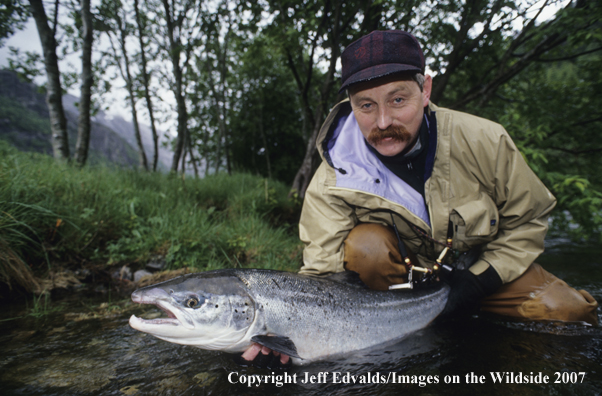 Flyfisherman with nice Atlantic Salmon