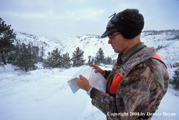 Big game hunter reading map.