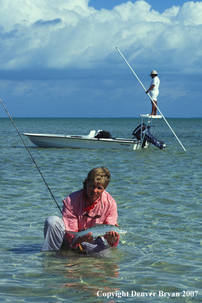 Saltwater flyfisherman holding bonefish.