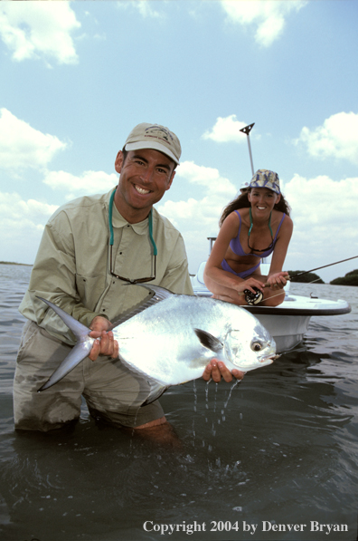 Saltwater flyfisherman holding permit.