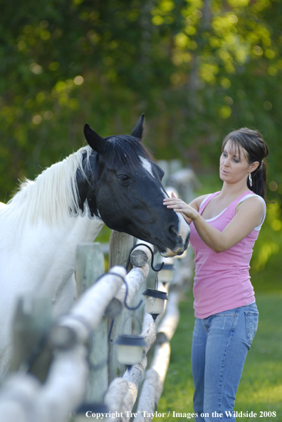 Yound lady with paint horse