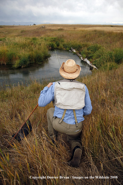 Flyfisherman looking over warm springs