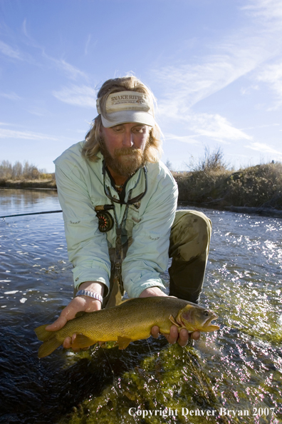 Flyfisherman with Snake River cutthroat trout.