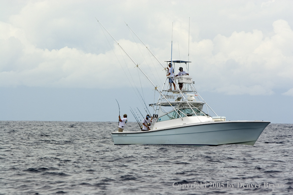 Deep sea fishing charter boat on ocean.