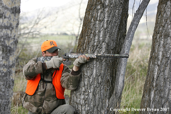 Big game hunter in field