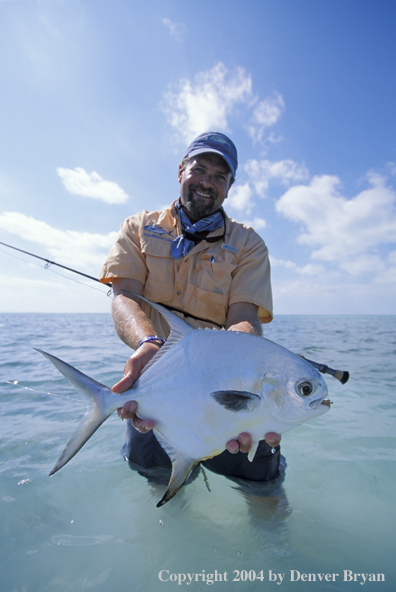 Saltwater flyfisherman holding permit.