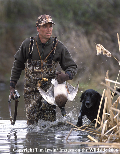 Waterfowl hunter with bagged duck.