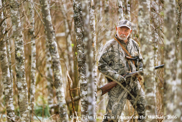 Muzzleloader hunter stalks big game.