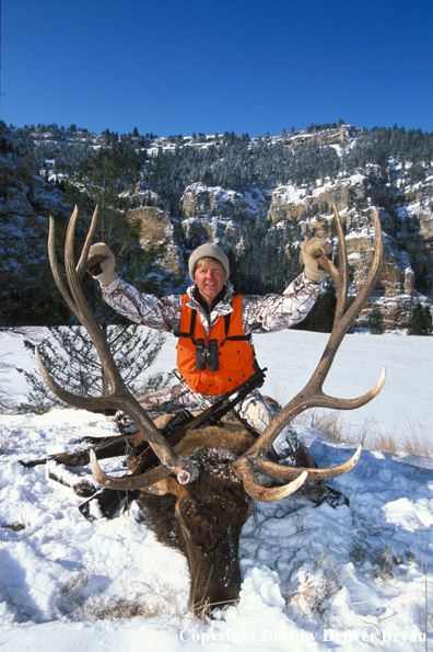 Big game hunter with bagged elk.