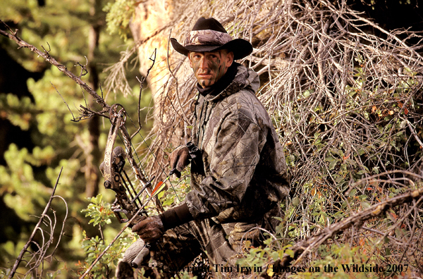 Bowhunter in brush.