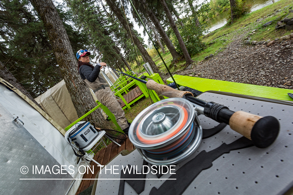 Camille Egdorf working on rod at fishing camp in Alaska.