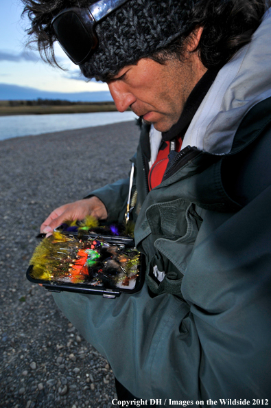 Flyfisherman looking at flies. 