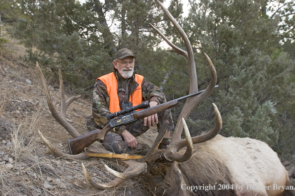 Big game hunter with bagged elk.