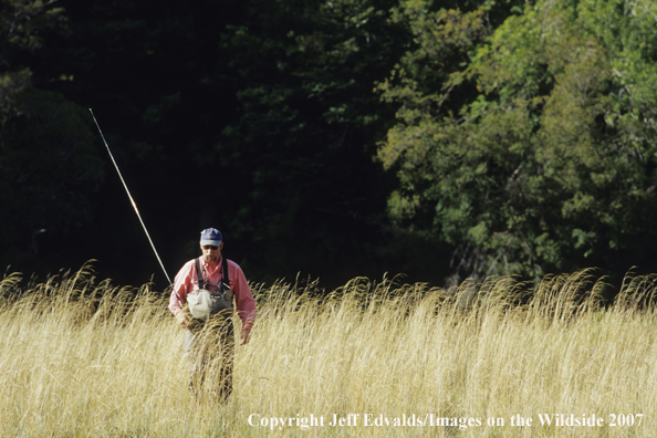 Fisherman walks back after fishing small hidden pool