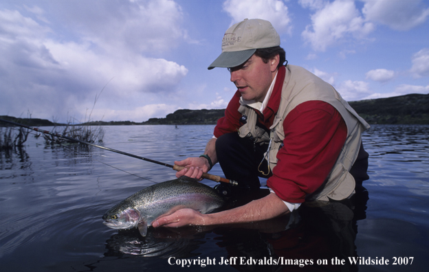 Flyfisherman with a nice Rainbow Trout