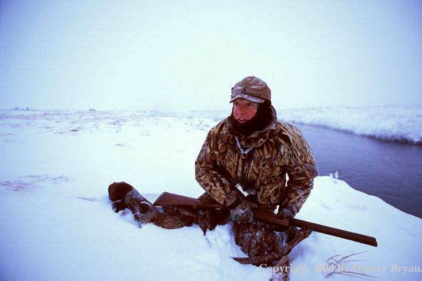 Waterfowl hunter and bagged ducks.