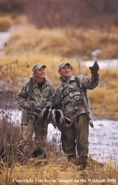 Waterfowl hunting couple.