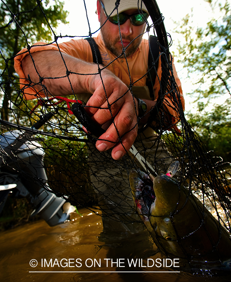 Fisherman with salmon.