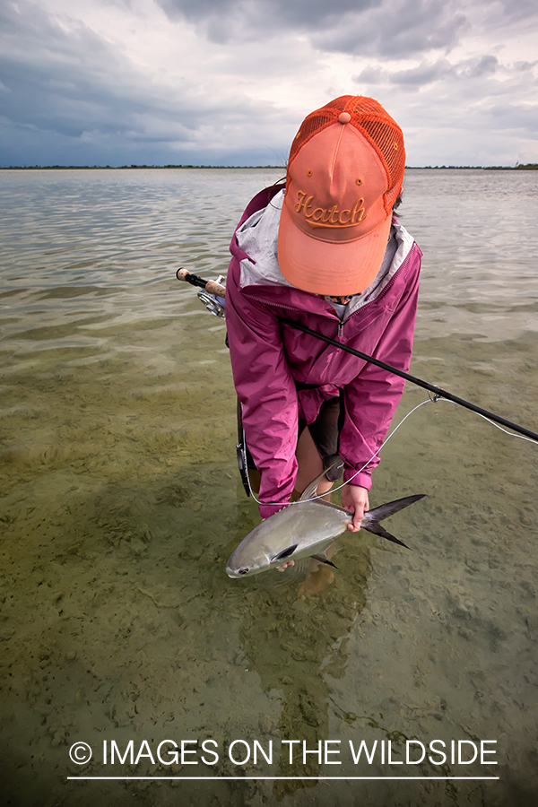 Flyfishing woman with permit.