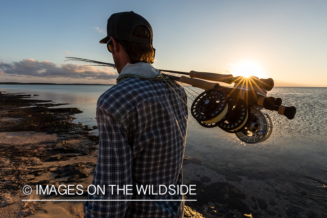 Flyfisherman on beach with fly rods.