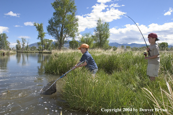 Kids landing fish