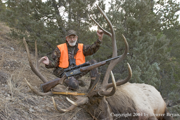 Big game hunter with bagged elk.