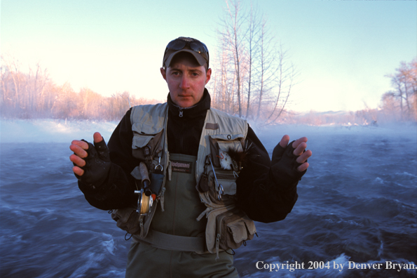 Flyfisherman showing how big his fish was.