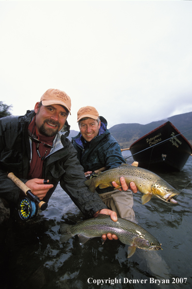 Flyfishermen holding trout.