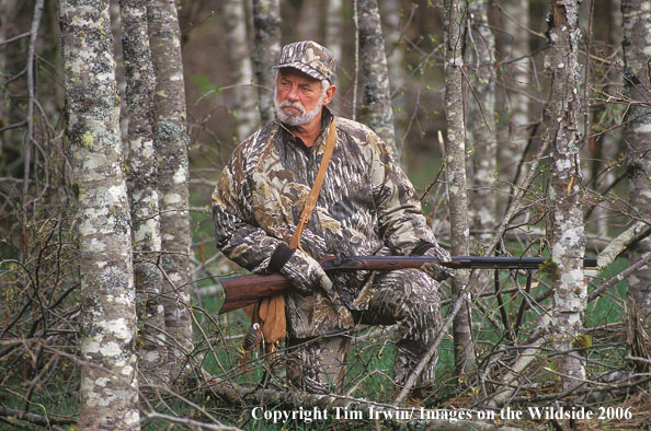 Muzzleloader hunter in field.