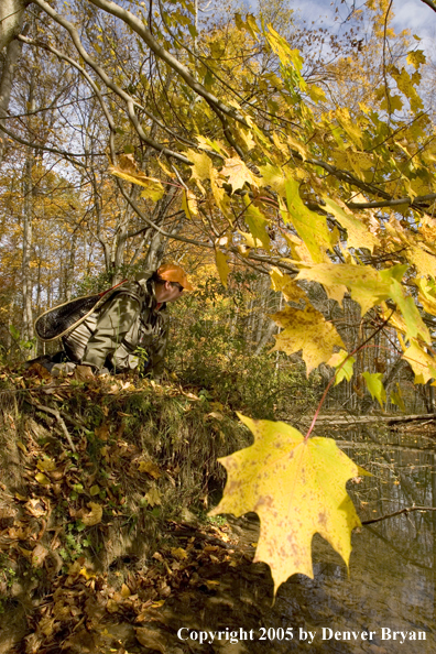 Flyfisherman checking out river before fishing.