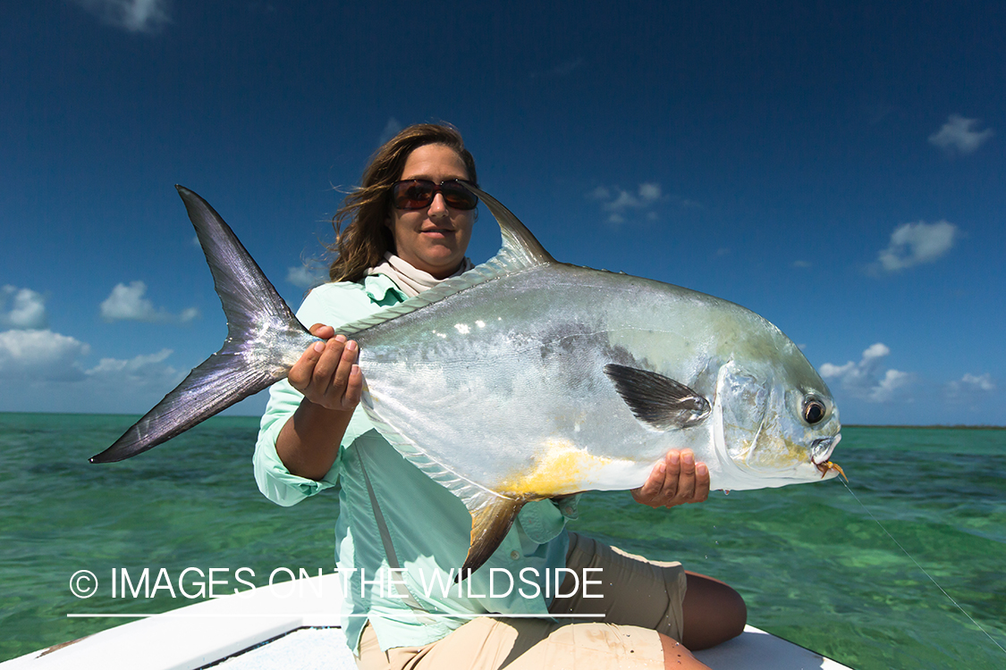 Flyfishing woman with permit.