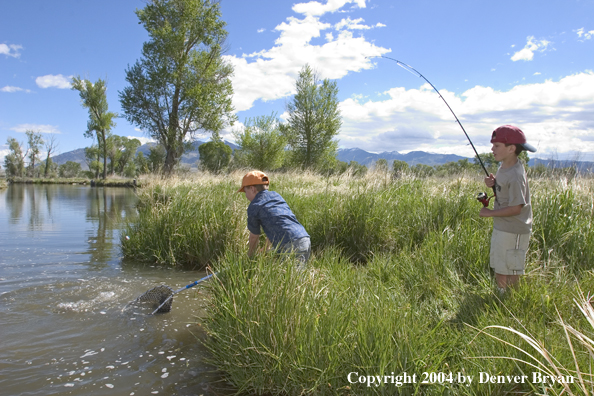 Kids landing fish
