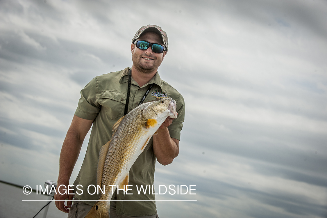 Fisherman with redfish.