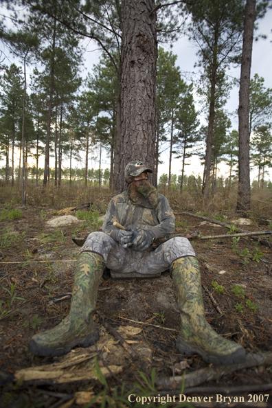 Turkey hunter calling in the field