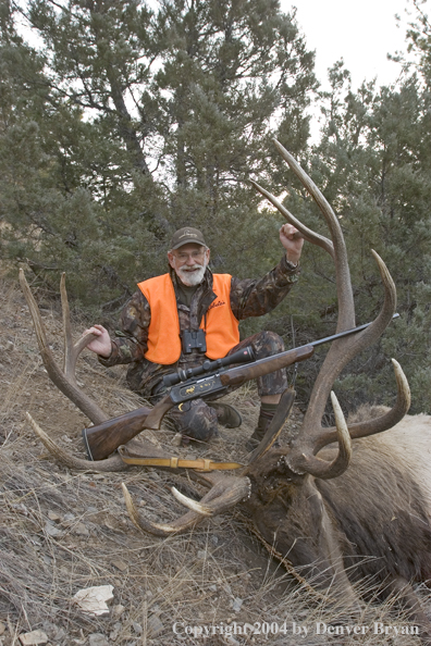 Big game hunter with bagged elk.