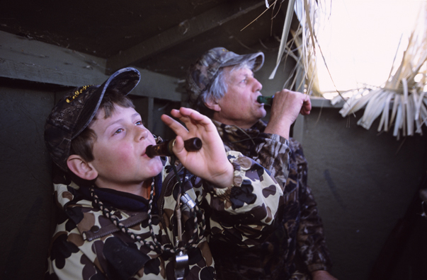 Waterfowl hunters calling for birds.