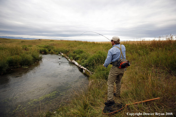 Flyfisherman with fish on