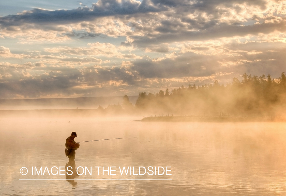 Flyfishing in fog on lake in Henry's Fork, ID.