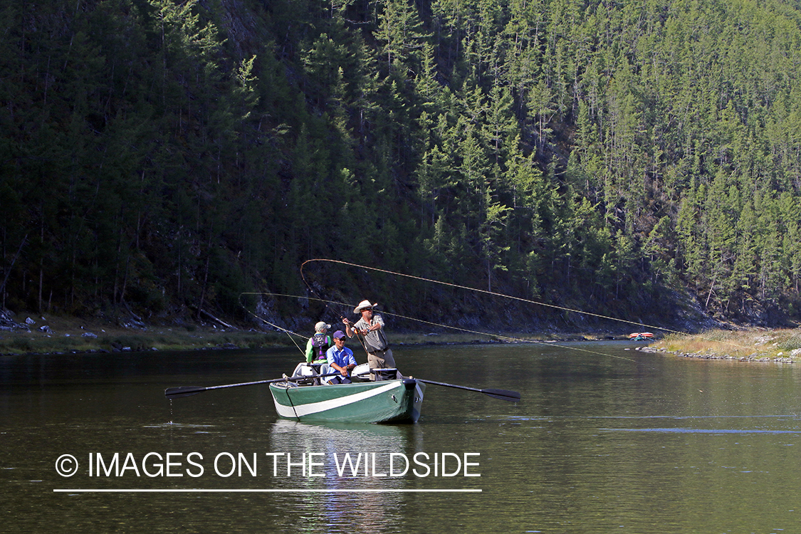 Flyfisherman casting spey/switch rod on Delger River, Mongolia.