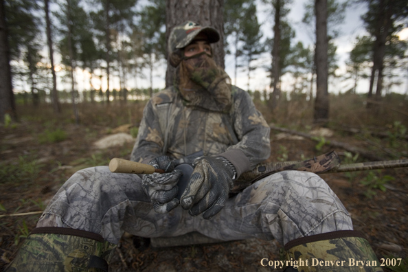 Turkey hunter calling in the field