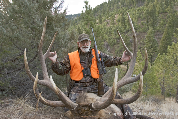 Big game hunter with bagged elk.