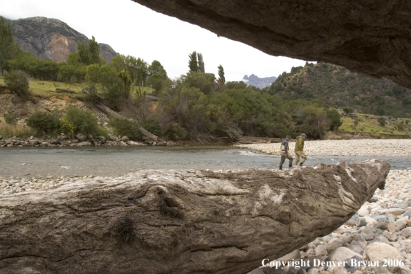 Flyfishermen walking up river.