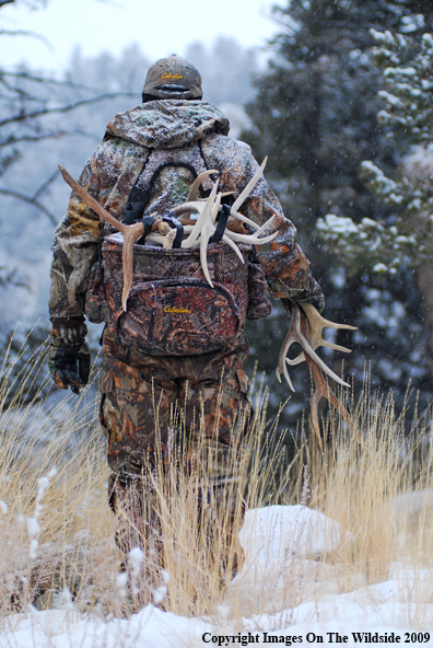 Hunter Collecting Antlers