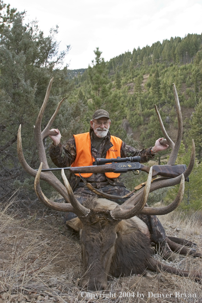 Big game hunter with bagged elk.