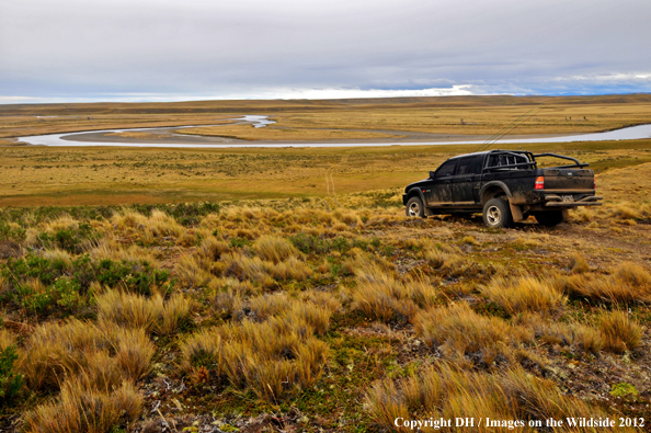 Flyfishermen driving through Tierra del Fuego. 