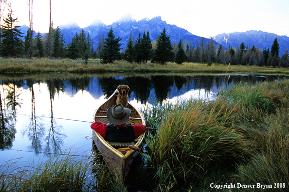 Flyfisherman and Dog in canoe