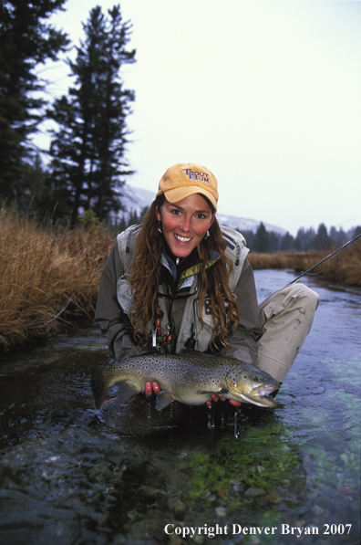 Flyfisher with brown trout.