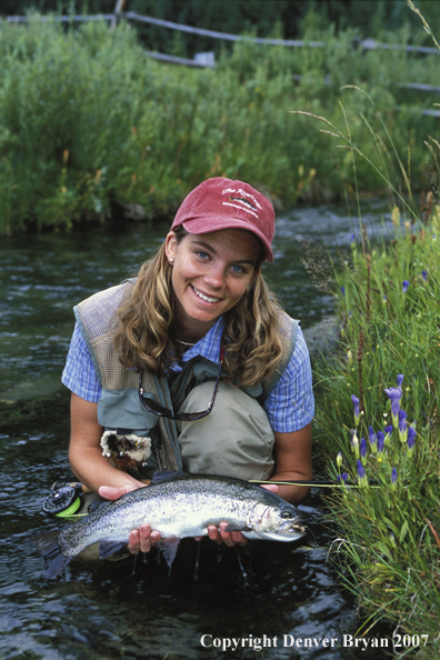 Flyfisher with rainbow trout.